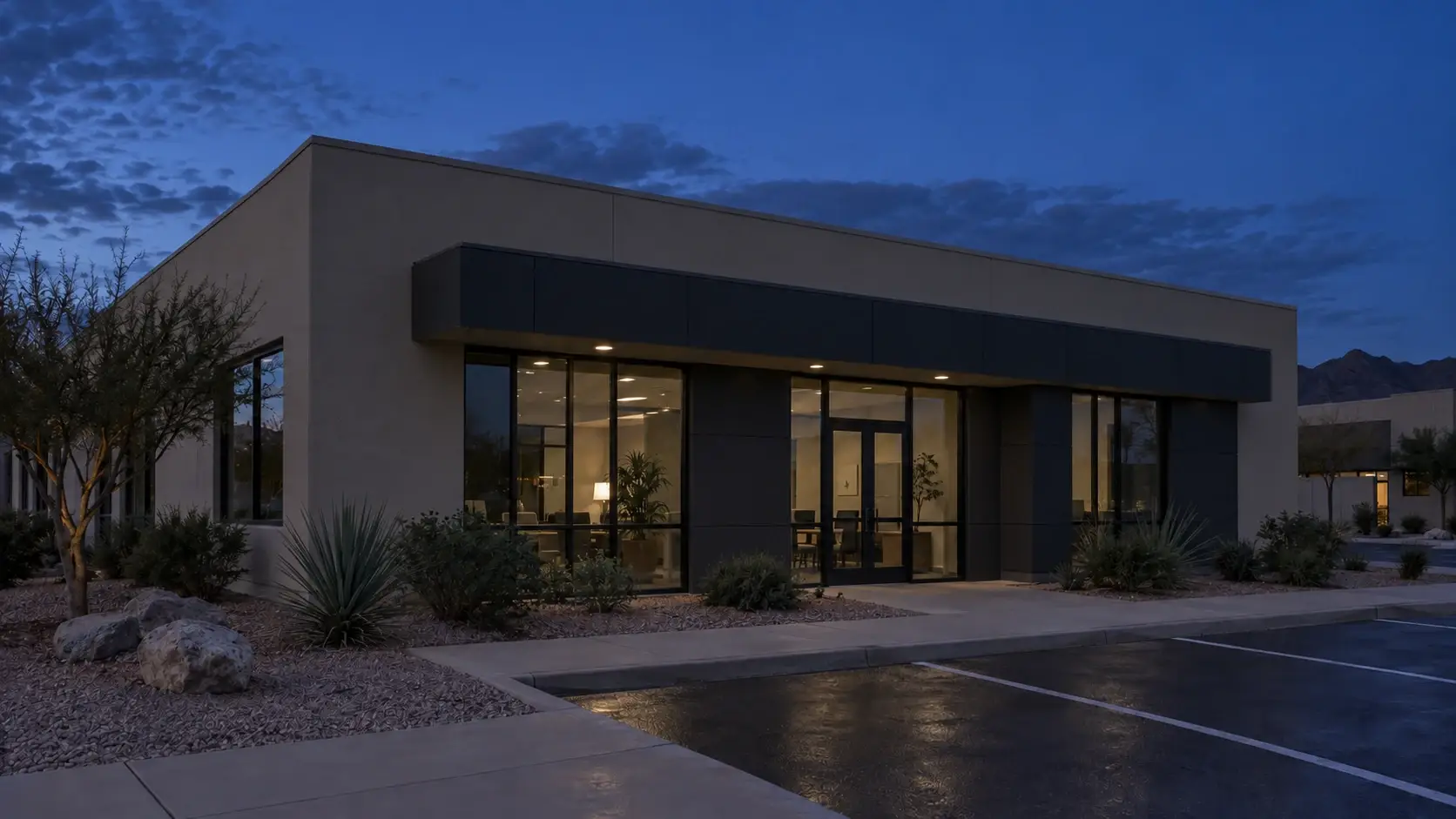 Example of a small office building at night with no roofline lighting