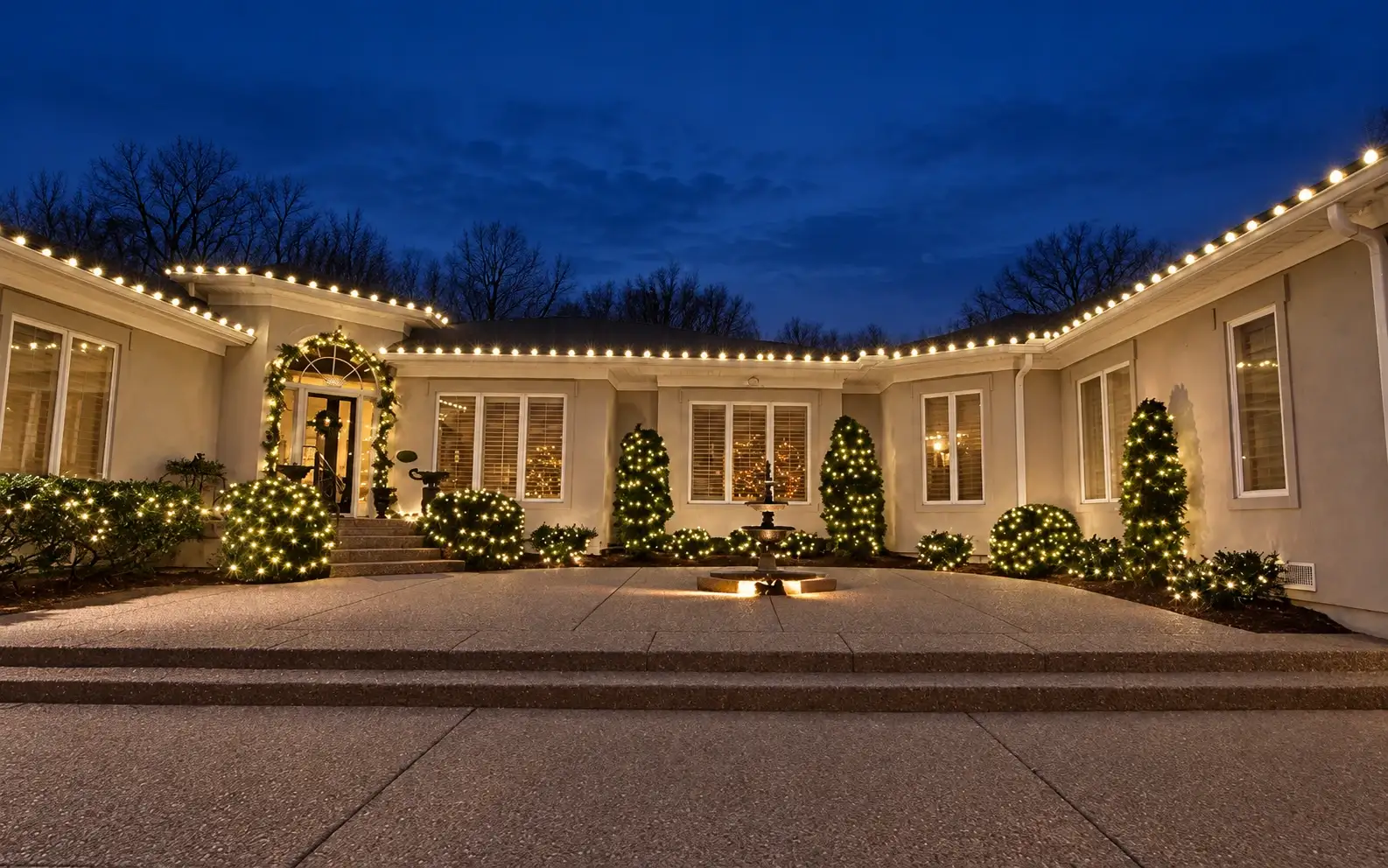 Single-story home with warm-white C9 bulbs along a long roofline at night