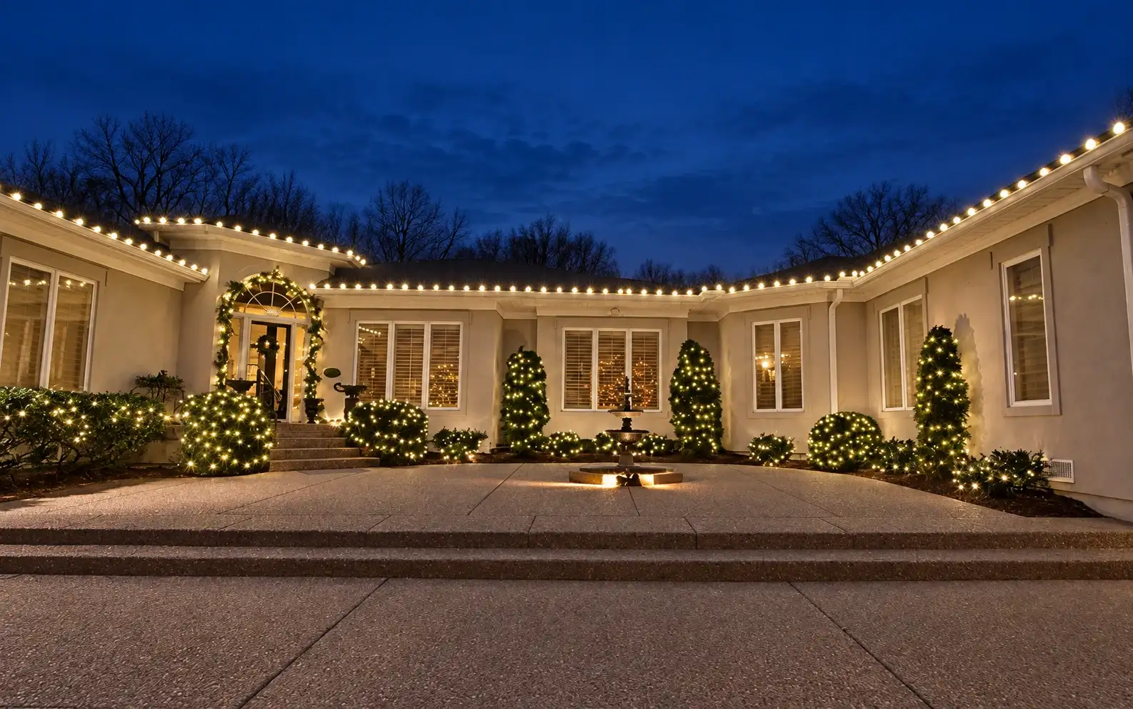Single-story home with warm-white C9 bulbs along a long roofline at night